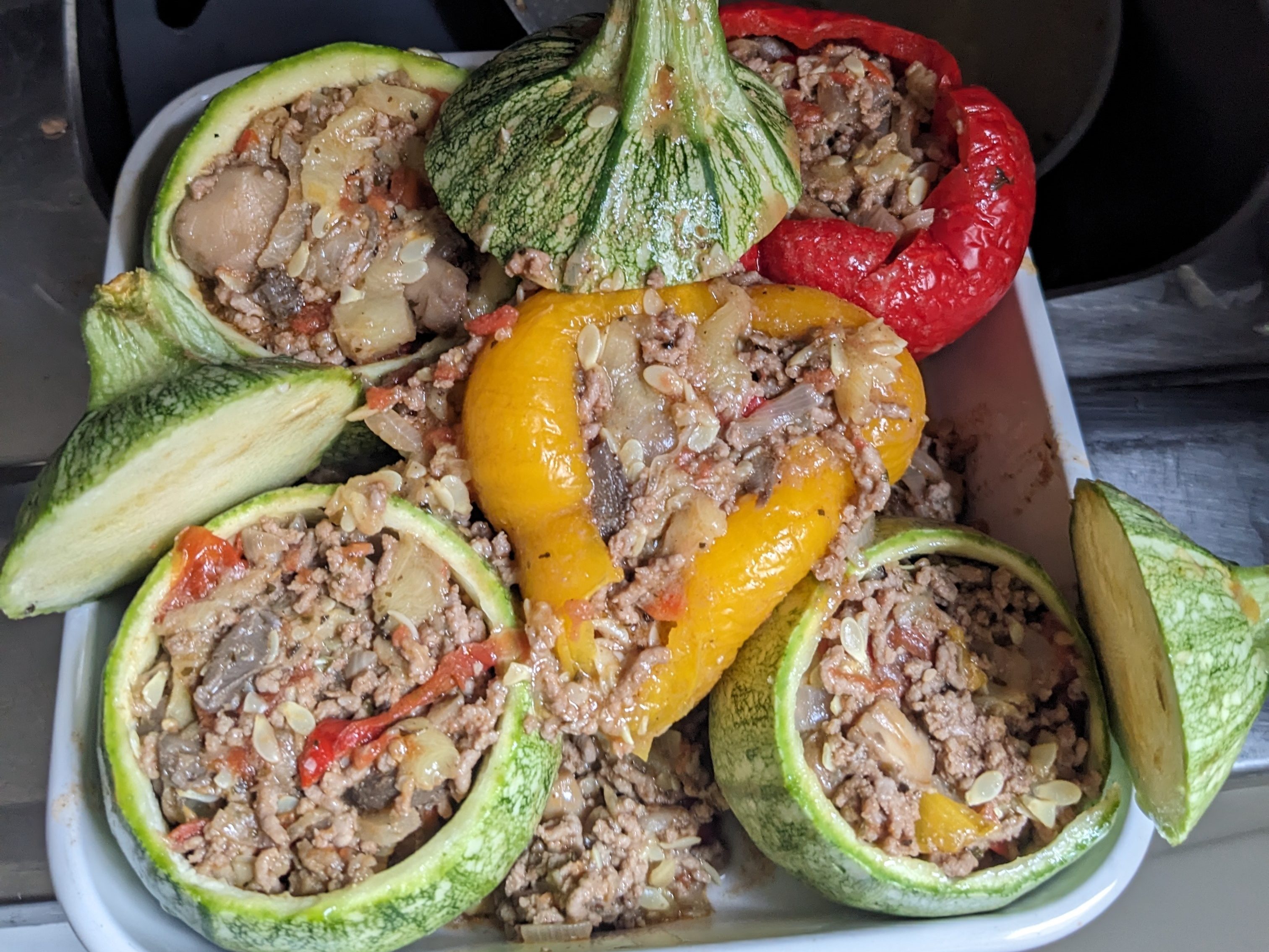 Recette de courgettes rondes et poivrons farcis